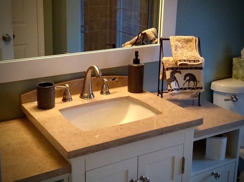 Photo: Tiered bathroom sink with accompanying cabinetry.